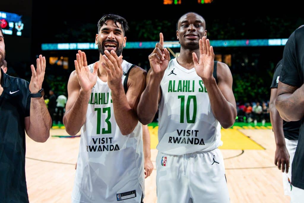 Al Ahli’s Mohamed Abdourahman #13 and Caleb Agada #10 celebrate the team’s last win