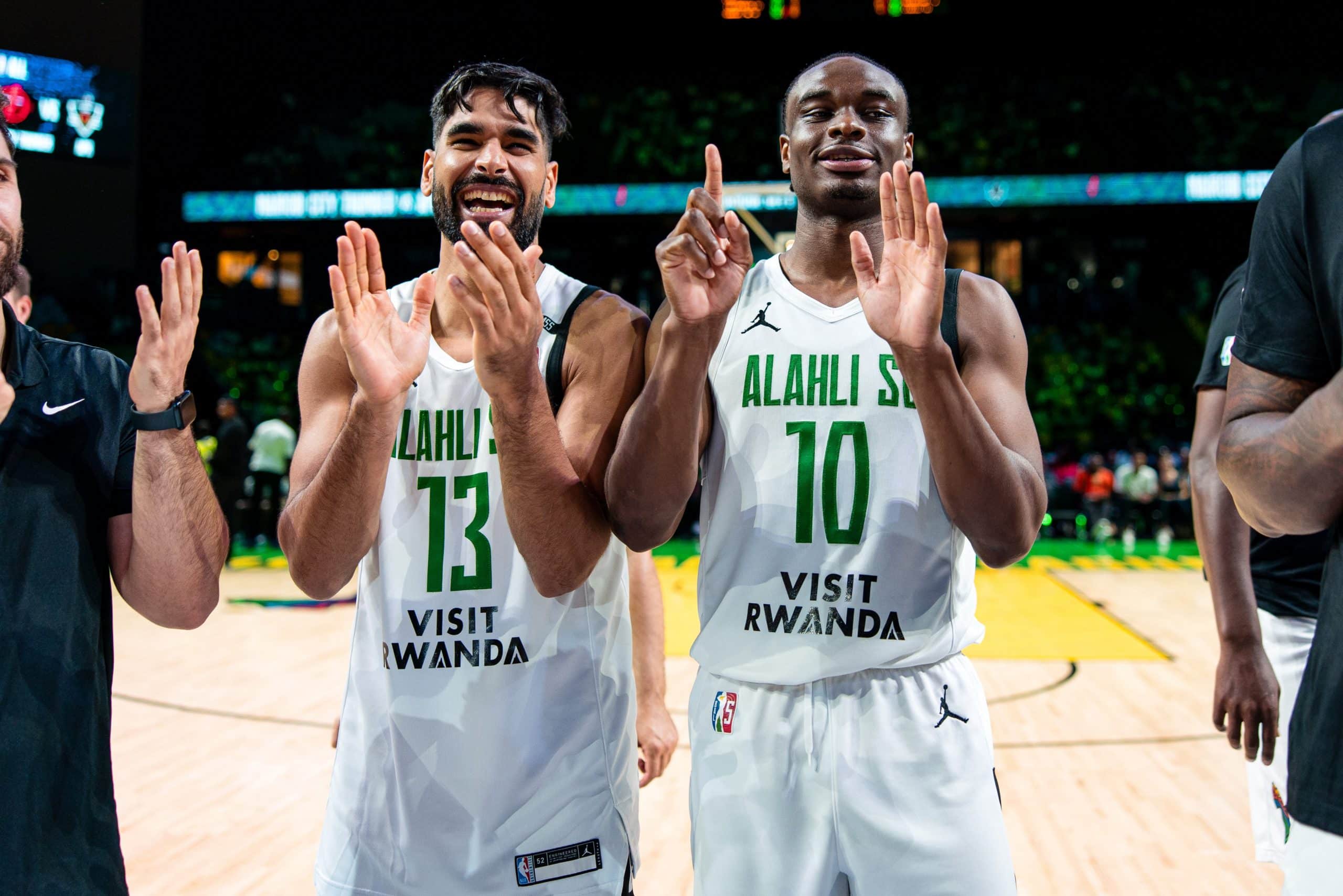 Al Ahli’s Mohamed Abdourahman #13 and Caleb Agada #10 celebrate the team’s last win